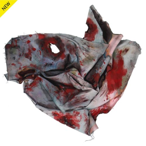 Mixed media of cloth with heart-like shape with large reddish spots and perforations