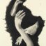 Graphite and compressed carbon drawing of hands protruding from a black hole on a wall by Susan Olivera